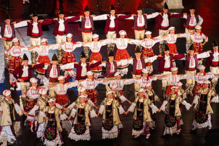 Photo for PLOVDIV, BULGARIA - JULY 29, 2019: Participants of the XV International Folklore Festival in the Roman theatre in Plovdiv, Bulgaria. - Royalty Free Image
