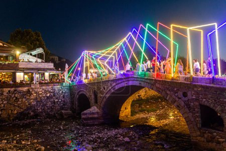 Photo for PRIZREN, KOSOVO - AUGUST 11, 2019: Evening view of the Stone bridge in old town in Prizren, Kosovo - Royalty Free Image