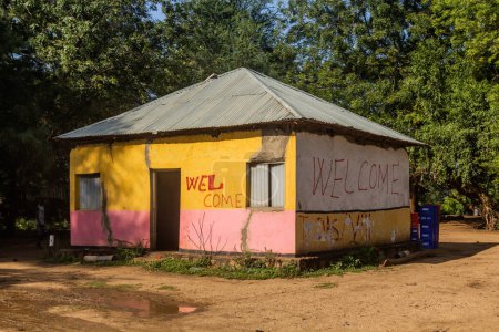 Photo for OMORATE, ETHIOPIA - FEBRUARY 5, 2020: House with text welcome in Omorate village in the area of Daasanach tribe in Omo valley, Ethiopia - Royalty Free Image