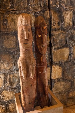 Photo for KONSO, ETHIOPIA - FEBRUARY 7, 2020: Waka (Waga) memorial wooden statues of Konso culture, Ethiopia. They are carved in honor of Konso warriors and their wives. - Royalty Free Image