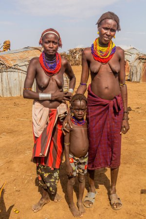 Photo for OMORATE, ETHIOPIA - FEBRUARY 5, 2020: Daasanach tribal women in their village near Omorate, Ethiopia - Royalty Free Image