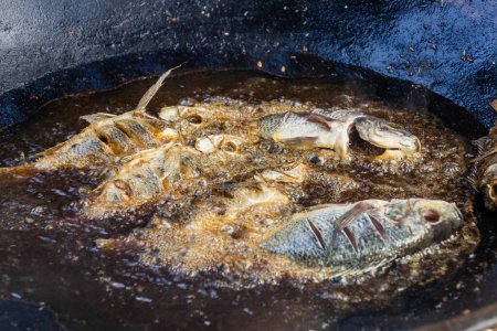 Photo for Fish being fried at the fish market in Hawassa, Ethiopia - Royalty Free Image