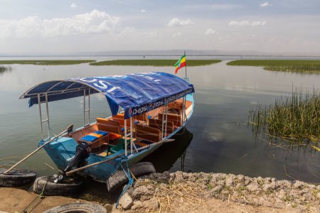 Photo for HAWASSA, ETHIOPIA - JANUARY 26, 2020: Small boat at Awassa lake in Hawassa, Ethiopia - Royalty Free Image