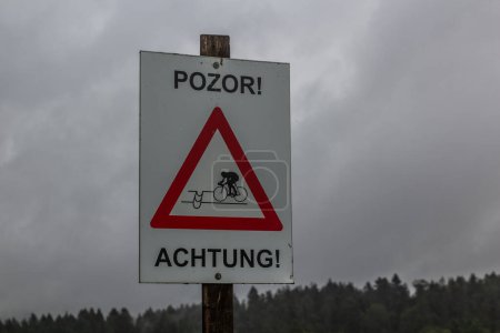 Photo for Warning sign for the cyclists in Czech and German, Czech Republic - Royalty Free Image