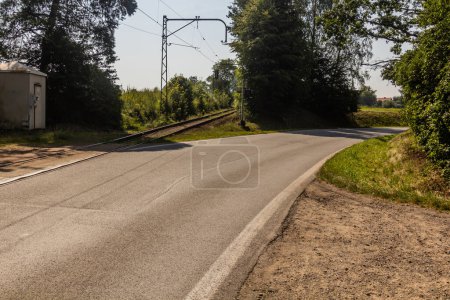 Photo for Road and railway splitting at the end of Duha (Rainbow) bridge with combined traffic in Bechyne town, Czech Republic - Royalty Free Image