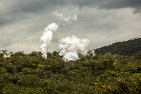 Steam rising above Olkaria Geothermal Power Station in the Hell's Gate National Park, Kenya