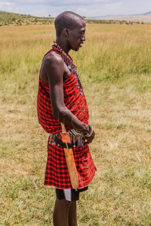 Photo for MASAI MARA, KENYA - FEBRUARY 19, 2020: Masai tribe member in Masai Mara National Reserve, Kenya - Royalty Free Image