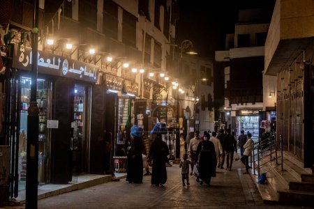 Photo for JEDDAH, SAUDI ARABIA - NOVEMBER 15, 2021: Night view of a street in Al Balad,  historic center of Jeddah, Saudi Arabia - Royalty Free Image