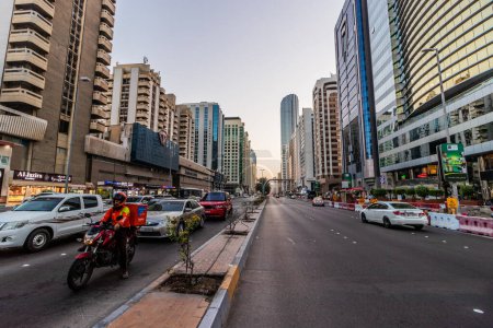 Photo for ABU DHABI, UAE - OCTOBER 13, 2021: Hamdan Bin Mohammed street in the Abu Dhabi downtown, United Arab Emirates. - Royalty Free Image