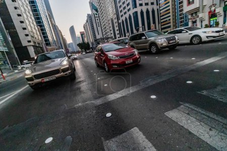 Photo for ABU DHABI, UAE - OCTOBER 20, 2021: Traffic on Khalifa Bin Zayed the First street in Abu Dhabi downtown, United Arab Emirates. - Royalty Free Image