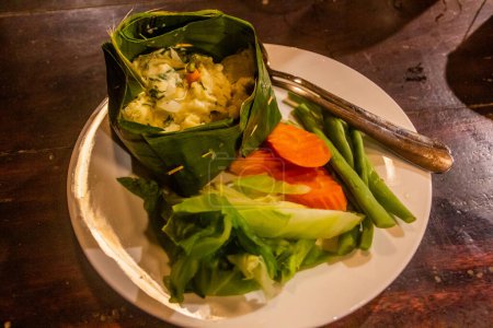 Laotian dish Mok Pa - fish steamed in babana leaves