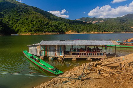 Photo for NAM OU, LAOS - NOVEMBER 23, 2019: Floating restaurant at Nam Ou 5 reservoir, Laos - Royalty Free Image