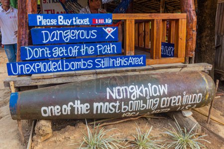 Photo for NONG KHIAW, LAOS - NOVEMBER 26, 2019:  Entrance to Nong Khiaw viewpoint decorated with a cluster bomb case, Laos - Royalty Free Image