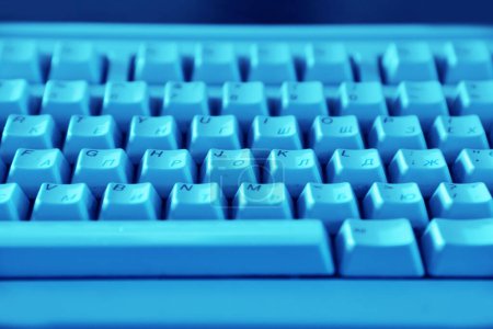 Photo for Keyboard in blue light, close-up - Royalty Free Image