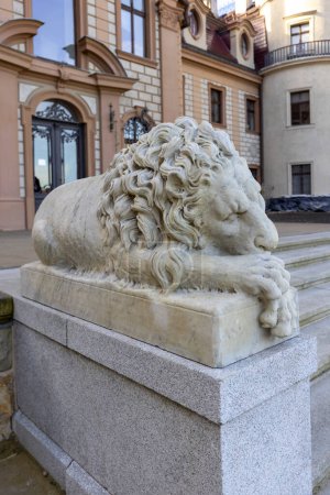 Photo for Moszna, Opole, Poland - November 12, 2022: 17th century Moszna Castle, statue of sleeping lion in front of building. Castle is one of the best known monuments in western part of Upper Silesia - Royalty Free Image