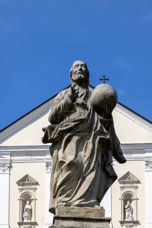 Photo for Kalwaria Zebrzydowska, Poland - August 18, 2022: Sculpture of saint on Paradise Square in front of 17th century Passion and Marian sanctuary of Bernardine Fathers - Royalty Free Image