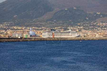 Photo for Naples, Italy - June 27, 2021: View of port and moored giant luxury cruise ship on a sunny day. Port Naples is one of the largest passenger and container ports in Italy - Royalty Free Image