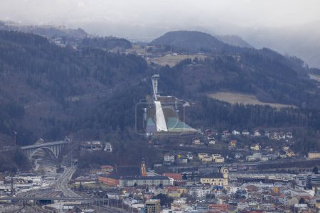 Photo for Innsbruck, Austria - February 26, 2023: Aerial view of city and Bergisel Ski Jump, facility of FIS World Cup in ski jumping. It is the venue of annual Four Hills Tournament competition - Royalty Free Image