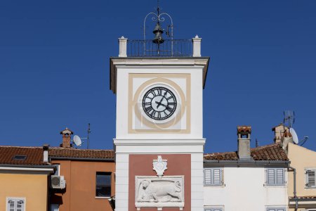 Photo for Rovinj, Croatia, Istria - September 29, 2023: Tower with city clock and relief of Venetian lion located on Marshal Tito Square - Royalty Free Image