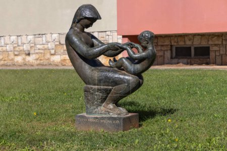 Photo for Porec, Croatia, Istria - September 25, 2023: Statue titled Mother's play, one of Porec Sculp Tours located on Marshal Tito Street - Royalty Free Image