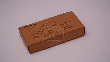 Photo for Cardboard box with USB cable on a white background - Royalty Free Image