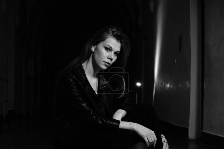 Photo for Beautiful young woman in the hall of the building posing at the camera - Royalty Free Image