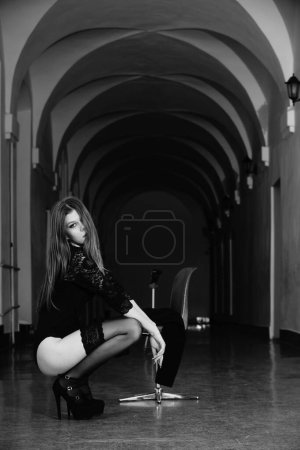 Photo for Beautiful young woman in the hall of the building posing at the camera - Royalty Free Image