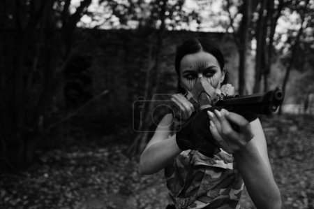 Photo for Black-white photo of a warrior girl in the forest - Royalty Free Image