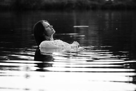 Photo for Black and white photo of a girl on a lake in the park - Royalty Free Image