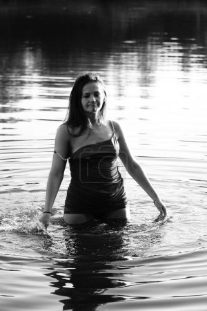 Photo for Black and white photo of a girl on a lake in the park - Royalty Free Image