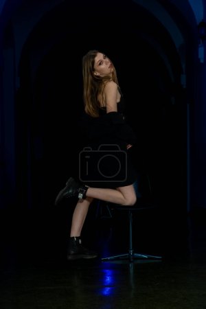 Photo for Portrait of a beautiful sensual young girl posing in a dark interior. Fashion photo. - Royalty Free Image