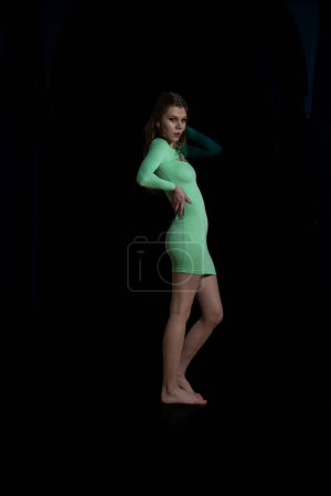 Photo for Portrait of a beautiful sensual young girl posing in a dark interior. Fashion photo. - Royalty Free Image