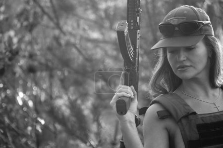 Photo for Black-white photo of a half-naked soldier girl in the forest - Royalty Free Image