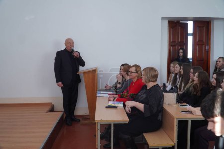 Photo for Lutsk, Ukraine: teacher speaking to students on award student ceremony on March 8 in Volyn Professional College of the National University of Food Technologies - Royalty Free Image