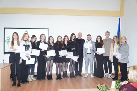 Photo for Lutsk, Ukraine: students in award student ceremony on March 8 in Volyn Professional College of the National University of Food Technologies - Royalty Free Image