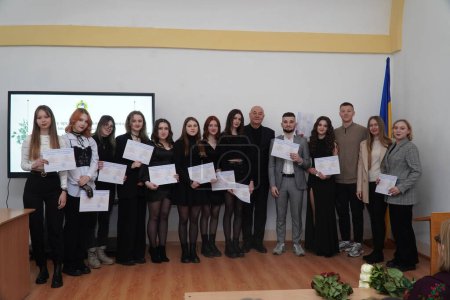 Photo for Lutsk, Ukraine: students in  award student ceremony on March 8 in Volyn Professional College of the National University of Food Technologies - Royalty Free Image