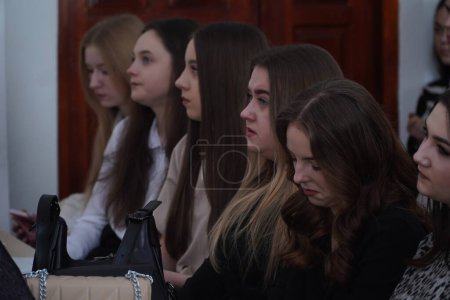 Photo for Lutsk, Ukraine: girls in award student ceremony on March 8 in Volyn Professional College of the National University of Food Technologies - Royalty Free Image