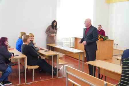 Photo for Lutsk, Ukraine: teacher speaking to students on award student ceremony on March 8 in Volyn Professional College of the National University of Food Technologies - Royalty Free Image