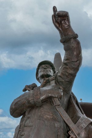 Photo for Fairbanks, Alaska, USA - July 27, 2011: Alaska Siberia World War II Memorial. Russian pilot points with his hand and finger in direction of his home country. Blue cloudscape in back. - Royalty Free Image