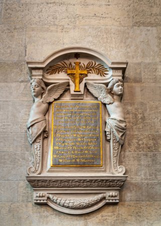 Photo for Copenhagen, Denmark - September 13, 2010: WW1 war memorial Epitaph closeup inside English or Saint Albans church with 2 angels, cross and text against beige inside wall - Royalty Free Image