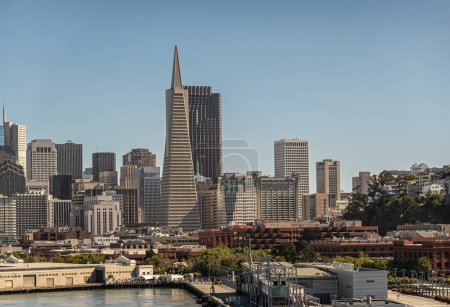 Photo for San Francisco, CA, USA - July 13, 2023: Red former Bank of America, 555 California Street, is tallest office building and hides behind TransAmerica Pyramid. Hilton hotel to the right - Royalty Free Image