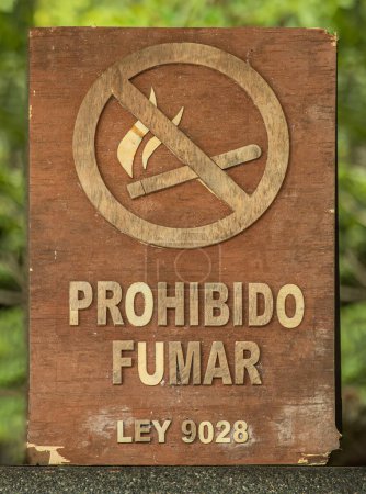 Photo for Costa Rica, Parque Nacional Carara - July 22, 2023 General Costa Rican non smoking sign with mentioning of the law 9028 in unilingual Spanish - Royalty Free Image
