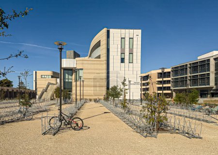 Photo for Santa Barbara, California, USA - March 17, 2024: UCSB, East facade of Interactive Learning Pavilion with bike parking lot under sunny blue sky - Royalty Free Image