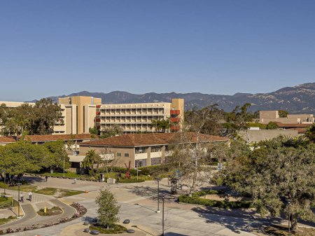 Photo for Santa Barbara, California, USA - March 17, 2024: UCSB, Department buildings, clockwise starting up front: Gnome, Girvetz hall, Mathematics, Linguistics, Chicano studies under sunny blue sky - Royalty Free Image