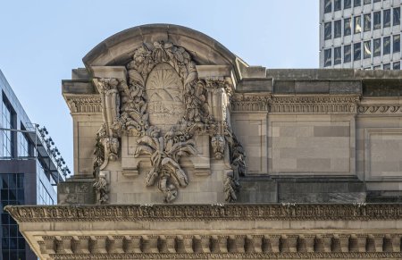 New York, NY, USA - August 2, 2023: Grand Central Terminal corner Vanderbilt Ave and east 42nd street. Eave corner sculpture on top of roof. 