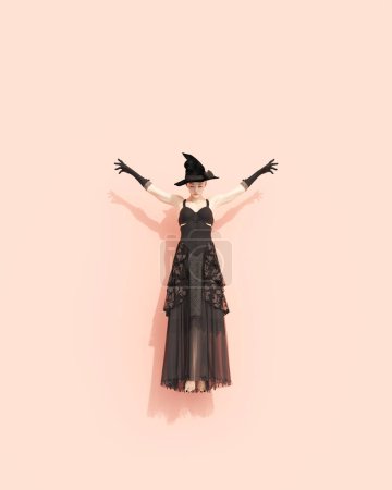 Photo for Witch black dress rose pink background witches hat gloves Halloween horror occult floating levitating 3d illustration render digital rendering - Royalty Free Image