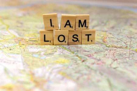 I am lost wooden letters on an old paper map.