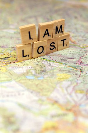I am lost wooden letters on an old paper map.