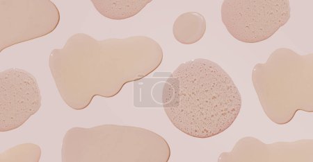 Photo for Drops and smears of cosmetics in different sizes. Drops of liquid gel with bubbles on a beige background. Banner - Royalty Free Image