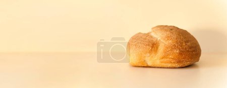 Photo for Bread lies on table on beige background. Healthy food concept. Space for text. Banner. Copy space - Royalty Free Image